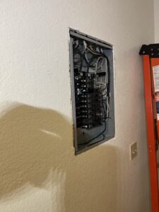 Apartment circuit breaker panel recessed into finished wall