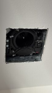 Bathroom exhaust fan housing installed in the ceiling