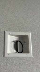 Electrical receptacle and plug in a recessed wall outlet box